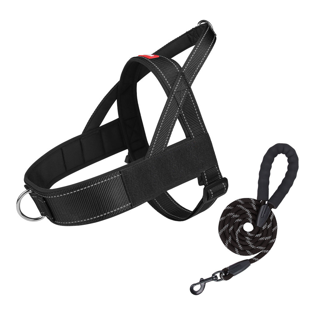 Black dog harness with a leash on a white background